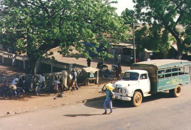 Bawku, Ghana, 1993. The main road in Bawku is used heavily by trucks like the one in this  picture. This particular truck belongs to Bawku Secondary School where the photographer  taught Science. Photo by Peace Corps Volunteer Wayne Breslyn